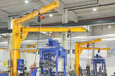 Double arm floor mounted cantilever jib cranes