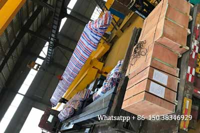 Electric overhead cranes loaded into truck to leave factory for delivery to Uganda