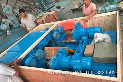 Overhead bridge crane hoists and parts packed into boxes for delivery 