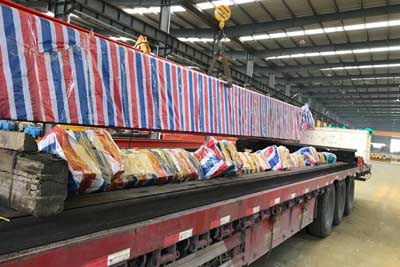 Complete overhead crane system and kits are packed and loaded into truck for delivery pakistan