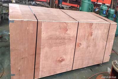 Electric hoists and hoist parts and components are packed into wooden box for delivery to Cambodia