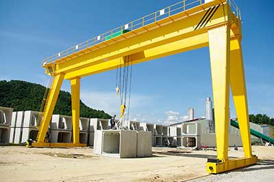 A frame gantry crane for outdoor cement work handling 