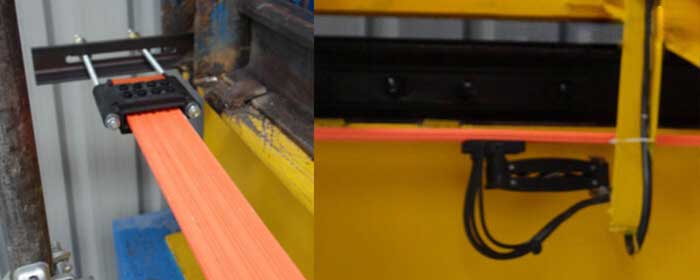 Overhead crane power line tensioner and current connector