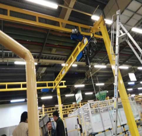 Rigid enclosed track workstation crane