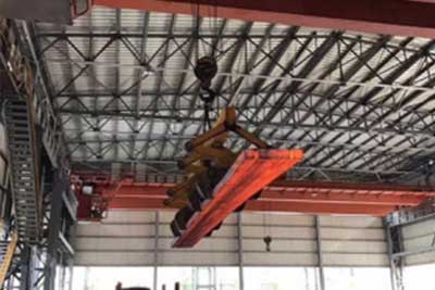 Billet crane - Double girder overhead crane with clamps for hot billet handing