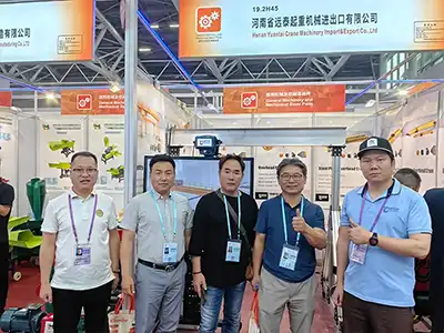 Business meeting between Yuantai Cranes and overseas industrial buyers, focusing on overhead crane engineering, factory production, and global project cooperation.