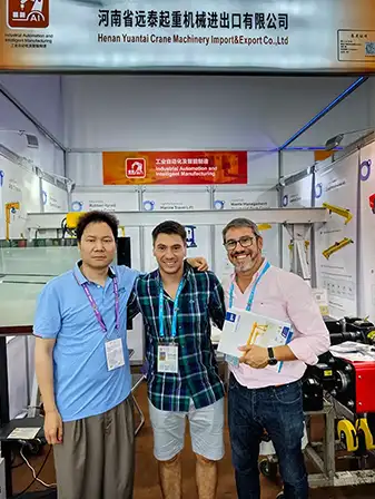 Overseas buyers discussing overhead crane projects with Yuantai Cranes engineers at the Canton Fair, exploring customized lifting solutions for industrial applications.