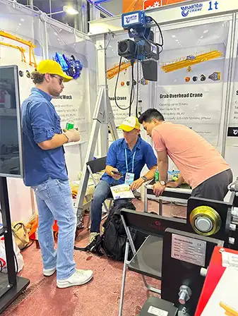 Yuantai Cranes technical team meeting with worldwide clients at the Canton Fair to discuss crane design, manufacturing capabilities, and project requirements.