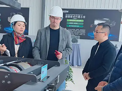 Spain customers inspecting Yuantai European style low headroom wire rope hoist production