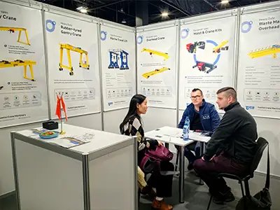 European visitors learning about Yuantai rail mounted gantry crane systems at Poland exhibition