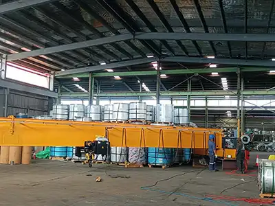 Papua New Guinea 10 Ton HD Single Girder Overhead Crane for Steel Coil Handling Yuantai Cranes 10 ton HD single girder overhead crane project in Papua New Guinea, equipped with a European style electric hoist for steel coil lifting, featuring 20.9 m span and 5.045 m lifting height.