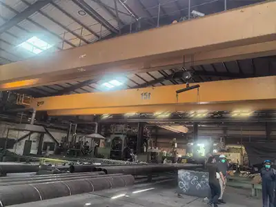 15 Ton Double Girder Overhead Crane Project in Pakistan Yuantai Cranes supplied a 15 ton QDX double girder overhead crane for a Pakistan industrial project. The crane features a 35 m span and 6.45 m lifting height, providing stable lifting support for large workshop areas.