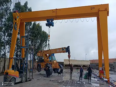 Two MH gantry cranes are going to Morocco, each able to lift 25 tons across a 20-meter span with 6 meters of lift. They run on ground rails and are controlled by pendant or remote, making them easy to use in yards or workshops.