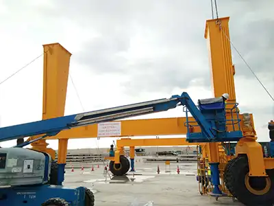 This Singapore order from Yuantai Cranes includes a 100 ton rubber tyred gantry crane designed specifically for construction sites. This 100 ton RTG crane lifts 100 tons across 11.5 meters up to 6 meters high, and its rubber tyres allow easy repositioning around the site without fixed rails — perfect for handling heavy beams, columns, and prefabricated components.