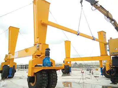 Yuantai Cranes is delivering a 100 ton rubber tyred gantry crane to Singapore for construction site logistics. This 100 ton RTG crane offers 11.5-meter span and 6-meter lift on 380V/50Hz/3P, with rubber-tyred mobility that eliminates the need for permanent tracks — allowing the construction site gantry crane to move freely between work zones.